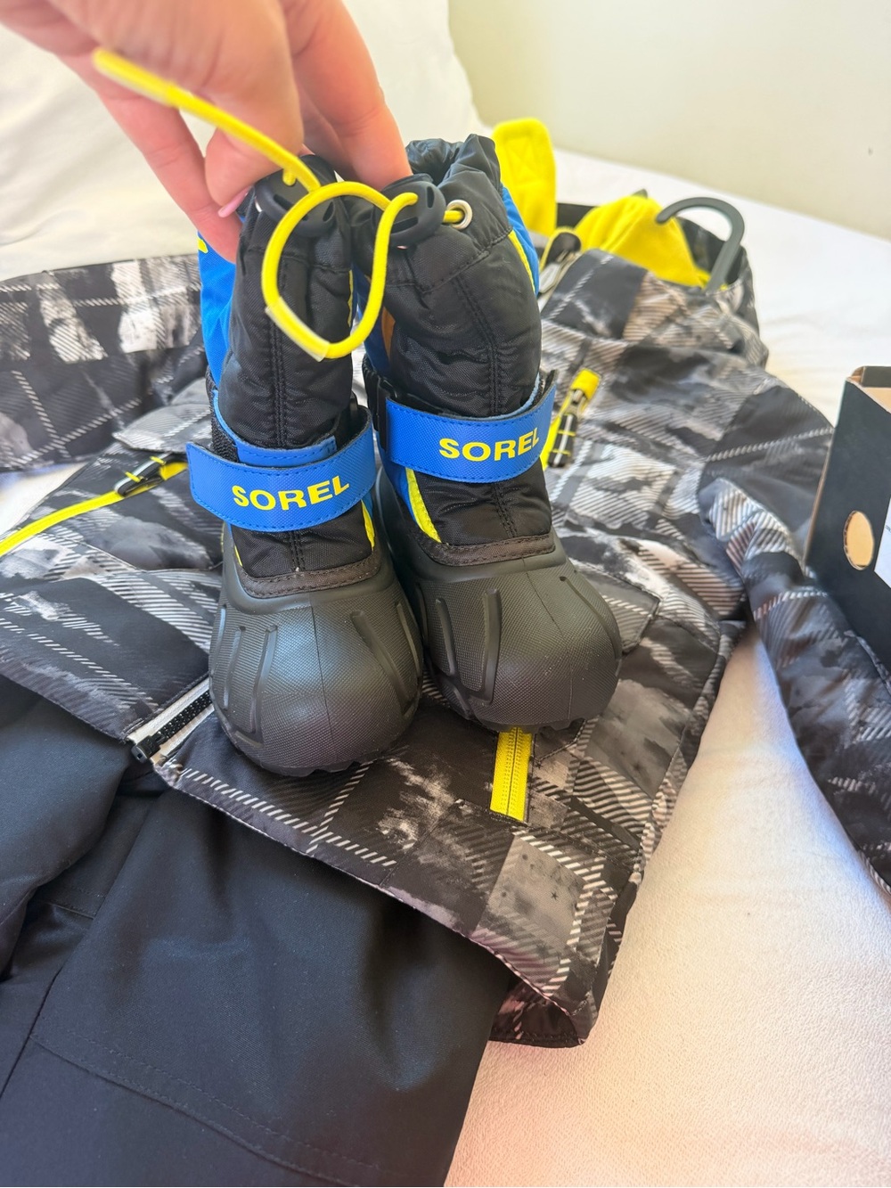 Sorel Kids Black, Blue & Yellow Snow Boots & snow gear.